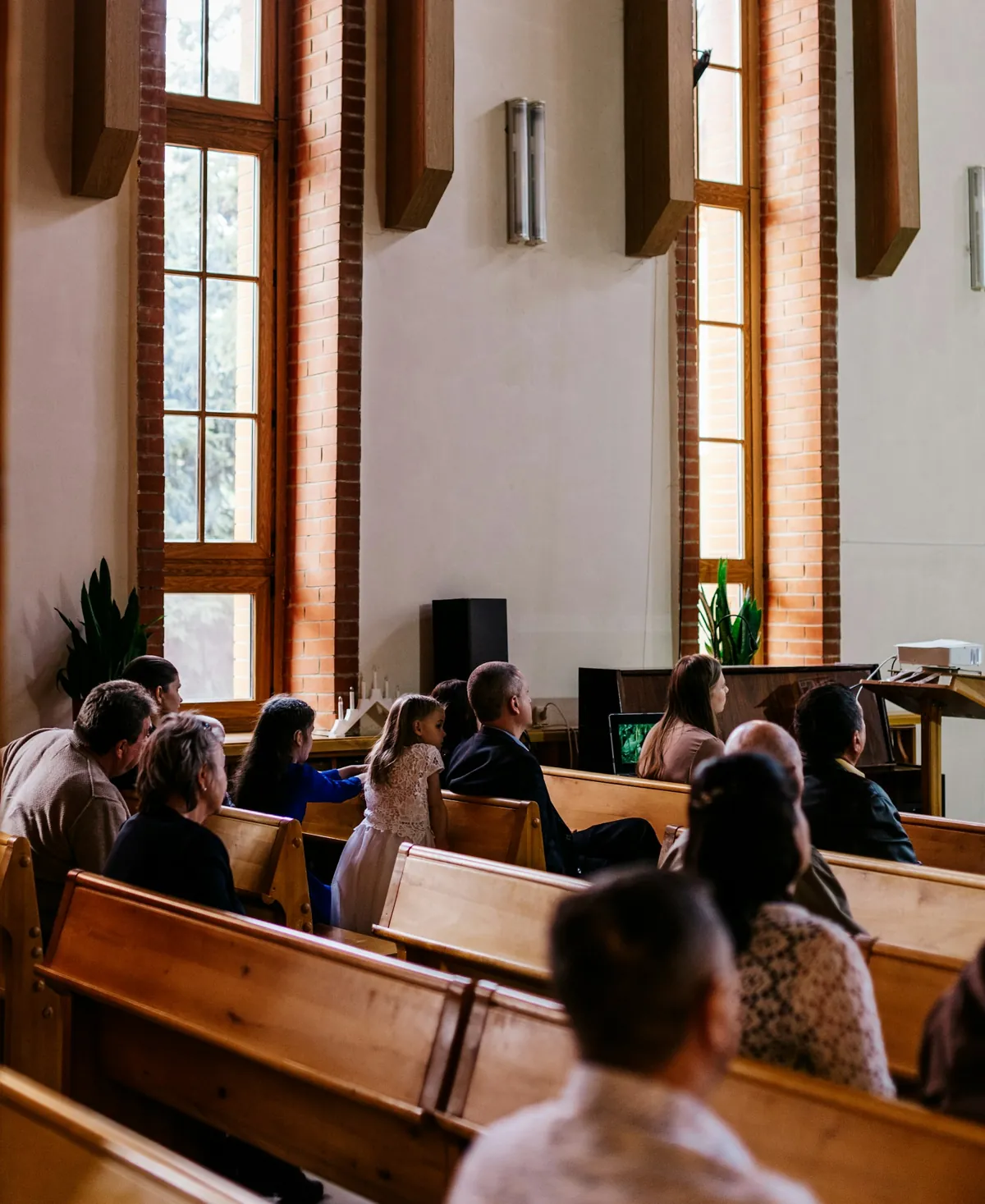 Congregation seated in wooden pews during a service